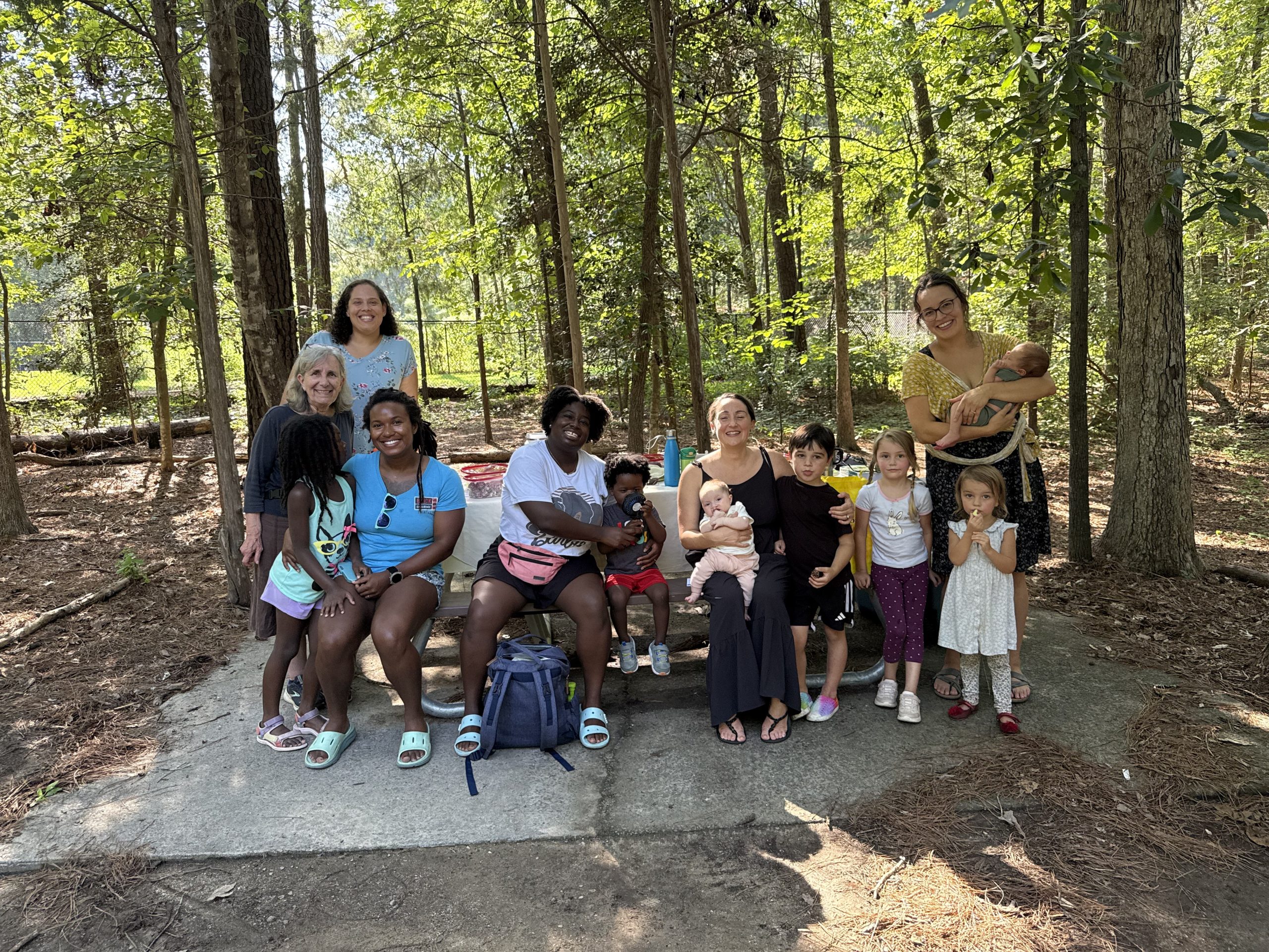 La Leche League leaders, parents and children playing together in a Durham park